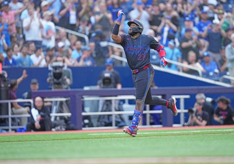 Jul 24, 2024; Toronto, Ontario, CAN; Toronto Blue Jays first baseman Vladimir Guerrero Jr. (27) runs the bases and celebrates hitting a home run against the Tampa Bay Rays during the third inning at Rogers Centre. Mandatory Credit: Nick Turchiaro-USA TODAY Sports