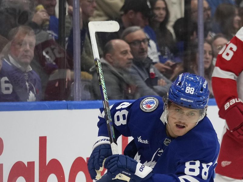 Nov 8, 2024; Toronto, Ontario, CAN; Toronto Maple Leafs forward William Nylander (88) skates against the Detroit Red Wings during the first period at Scotiabank Arena. Mandatory Credit: John E. Sokolowski-Imagn Images