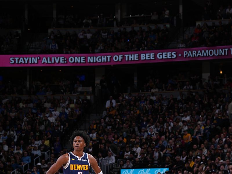 DENVER, CO - APRIL 10: Peyton Watson #8 of the Denver Nuggets looks on during the game against the Minnesota Timberwolves on April 10, 2024 at the Ball Arena in Denver, Colorado. NOTE TO USER: User expressly acknowledges and agrees that, by downloading and/or using this Photograph, user is consenting to the terms and conditions of the Getty Images License Agreement. Mandatory Copyright Notice: Copyright 2024 NBAE (Photo by Garrett Ellwood/NBAE via Getty Images)