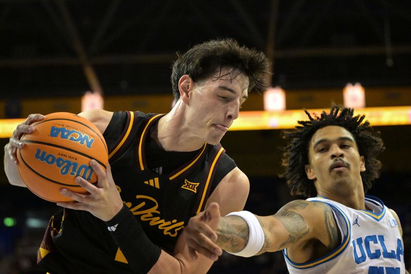Dec 17, 2025; Los Angeles, California, USA;  Arizona State Sun Devils forward Andrija Grbovic (14) beats UCLA Bruins guard Skyy Clark (55) to a rebound in the first half at Pauley Pavilion presented by Wescom Financial. Mandatory Credit: Jayne Kamin-Oncea-Imagn Images 