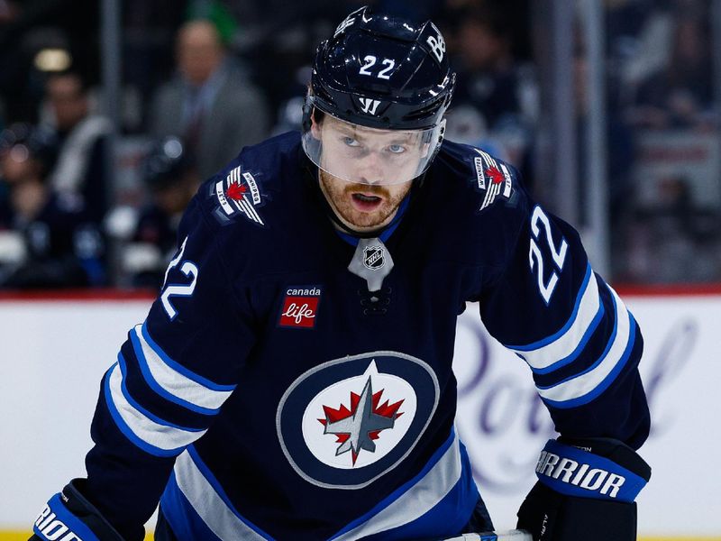 Jan 24, 2025; Winnipeg, Manitoba, CAN; Winnipeg Jets forward Mason Appleton (22) awaits the face off against the Utah Hockey Club during the second period at Canada Life Centre. Mandatory Credit: Terrence Lee-Imagn Images