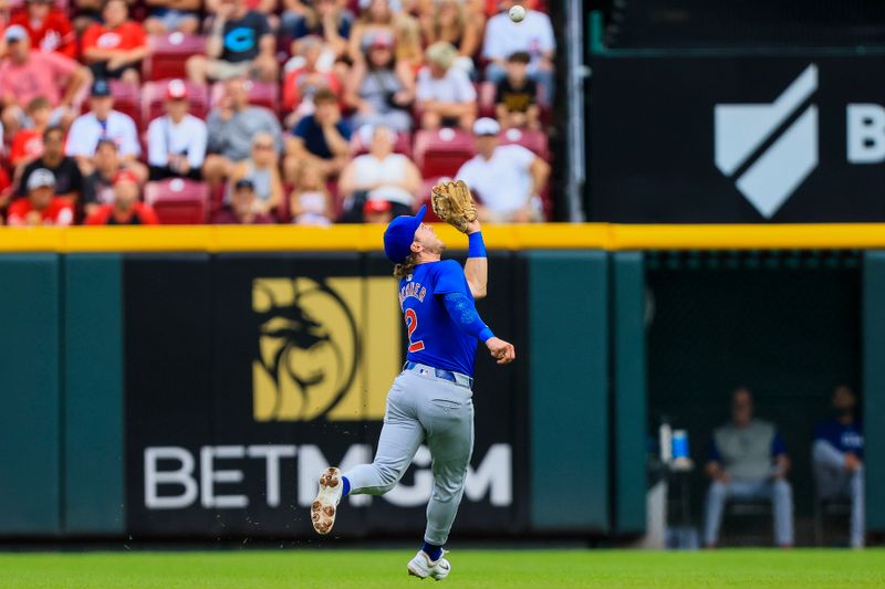 Jul 31, 2024; Cincinnati, Ohio, USA; Chicago Cubs second baseman Nico Hoerner (2) catches a pop up hit by Cincinnati Reds second baseman Jonathan India (not pictured) in the first inning at Great American Ball Park. Mandatory Credit: Katie Stratman-USA TODAY Sports