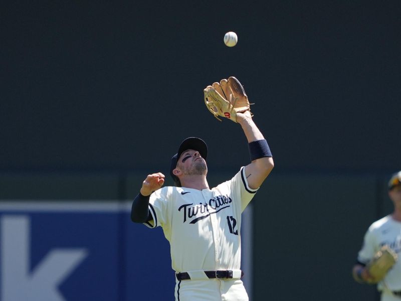 Aug 11, 2024; Minneapolis, Minnesota, USA; Minnesota Twins second baseman Kyle Farmer (12) makes the catch for the out during the second inning against the Cleveland Guardians at Target Field. Mandatory Credit: Jordan Johnson-USA TODAY Sports