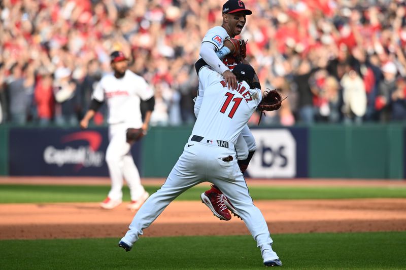 Oct 12, 2024; Cleveland, Ohio, USA; Cleveland Guardians third base José Ramírez (11) celebrates with shortstop Brayan Rocchio (4) after defeating the Detroit Tigers during game five of the ALDS for the 2024 MLB Playoffs at Progressive Field. Mandatory Credit: Ken Blaze-Imagn Images