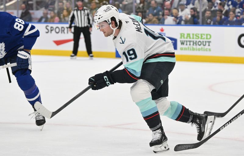 Oct 31, 2024; Toronto, Ontario, CAN;  Seattle Kraken forward Jared McCann (19) pursues the play against the Toronto Maple Leafs in the first period at Scotiabank Arena. Mandatory Credit: Dan Hamilton-Imagn Images