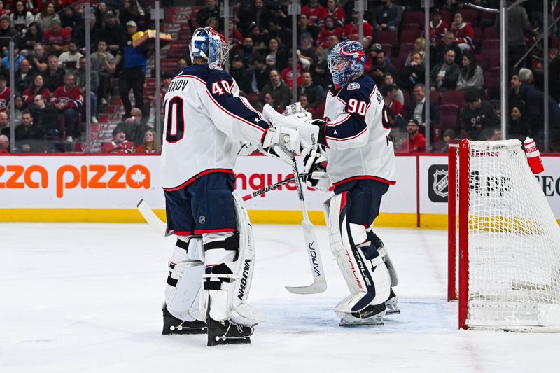 Mar 12, 2024; Montreal, Quebec, CAN; Columbus Blue Jackets goalie Daniil Tarasov (40) replaces goalie Elvis Merzlikins (90) against the Montreal Canadiens during the first period at Bell Centre. Mandatory Credit: David Kirouac-USA TODAY Sports