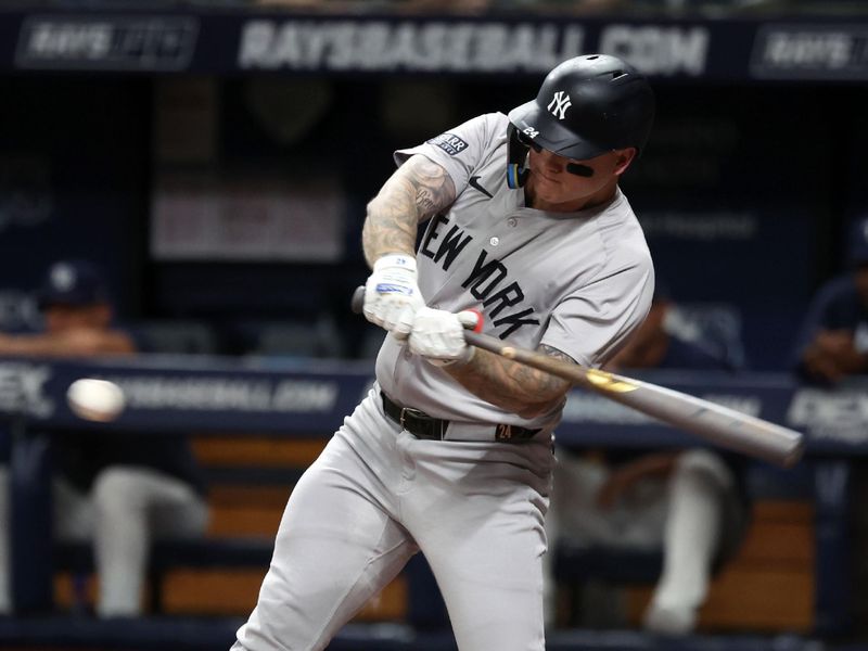 Jul 9, 2024; St. Petersburg, Florida, USA;  New York Yankees outfielder Alex Verdugo (24) singles against the Tampa Bay Rays during the first inning at Tropicana Field. Mandatory Credit: Kim Klement Neitzel-USA TODAY Sports