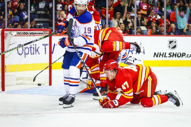 Sep 23, 2024; Calgary, Alberta, CAN; Calgary Flames center Connor Zary (47) scores a goal against the Edmonton Oilers during the second period at Scotiabank Saddledome. Mandatory Credit: Sergei Belski-Imagn Images