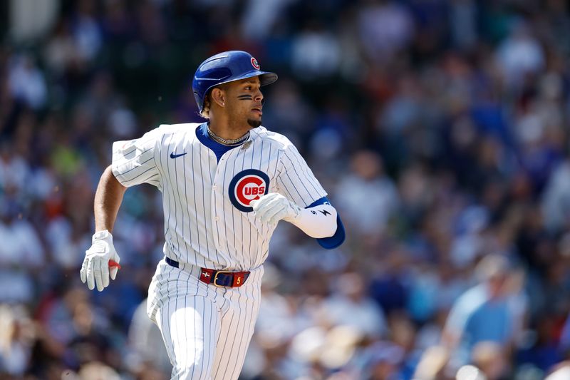 May 3, 2024; Chicago, Illinois, USA; Chicago Cubs third baseman Christopher Morel (5) rounds the bases after hitting a solo home run against the Milwaukee Brewers during the sixth inning at Wrigley Field. Mandatory Credit: Kamil Krzaczynski-USA TODAY Sports