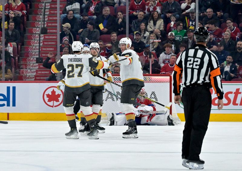 Nov 16, 2023; Montreal, Quebec, CAN; Vegas Golden Knights defenseman Shea Theodore (27) celebrates with teammates after scoring a goal against Montreal Canadiens goalie Cayden Primeau (30) during the second period at the Bell Centre. Mandatory Credit: Eric Bolte-USA TODAY Sports