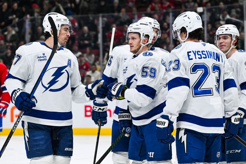 Jan 21, 2025; Montreal, Quebec, CAN; Tampa Bay Lightning center Jake Guentzel (59) celebrates with his teammates after a goal against the Montreal Canadiens during the second period at Bell Centre. Mandatory Credit: David Kirouac-Imagn Images