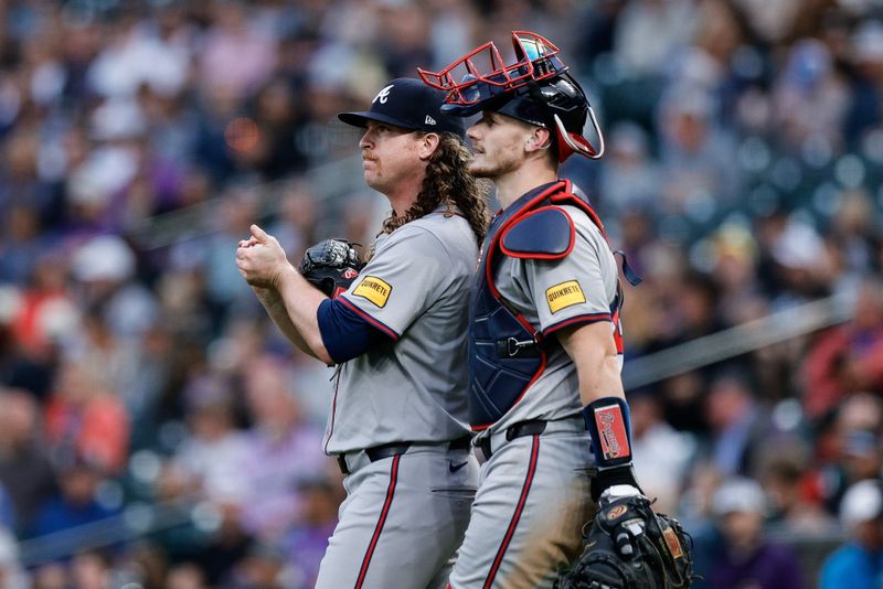 Aug 9, 2024; Denver, Colorado, USA; Atlanta Braves starting pitcher Grant Holmes (66) talks with catcher Sean Murphy (12) in the third inning against the Colorado Rockies at Coors Field. Mandatory Credit: Isaiah J. Downing-USA TODAY Sports