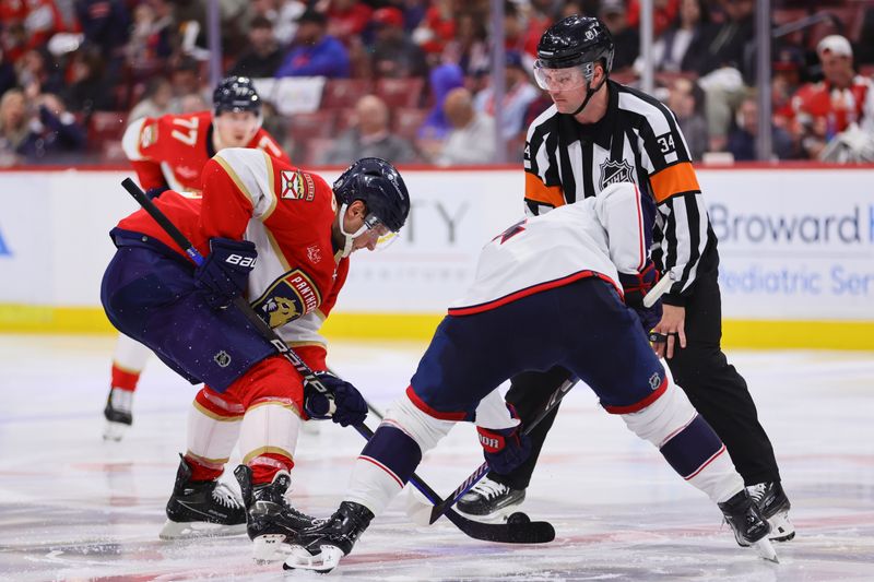 Apr 11, 2024; Sunrise, Florida, USA; Florida Panthers center Aleksander Barkov (16) and Columbus Blue Jackets center Cole Sillinger (4) face-off during the second period at Amerant Bank Arena. Mandatory Credit: Sam Navarro-USA TODAY Sports