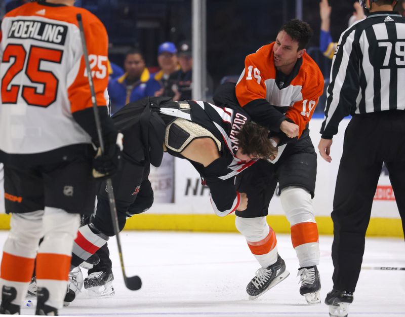 Nov 3, 2023; Buffalo, New York, USA;  Buffalo Sabres center Dylan Cozens (24) and Philadelphia Flyers right wing Garnet Hathaway (19) fight during the third period at KeyBank Center. Mandatory Credit: Timothy T. Ludwig-USA TODAY Sports