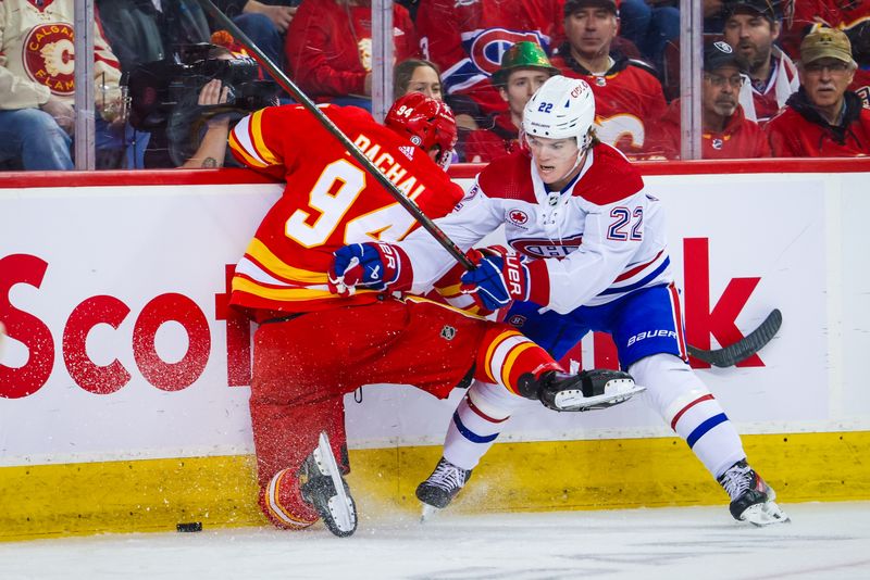 Mar 16, 2024; Calgary, Alberta, CAN; Montreal Canadiens right wing Cole Caufield (22) and Calgary Flames defenseman Brayden Pachal (94) battles for the puck during the first period at Scotiabank Saddledome. Mandatory Credit: Sergei Belski-USA TODAY Sports