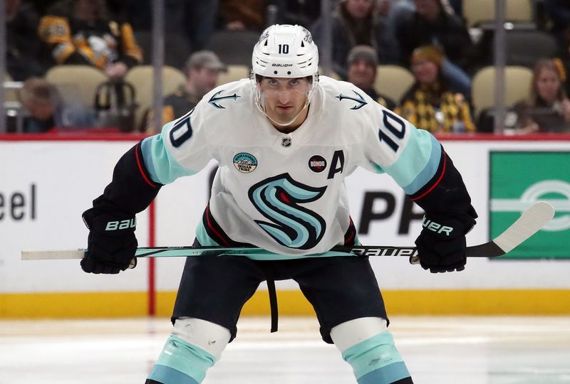 Jan 14, 2025; Pittsburgh, Pennsylvania, USA;  Seattle Kraken center Matty Beniers (10) waits to take the opening face-off of the third period against the Pittsburgh Penguins at PPG Paints Arena. Mandatory Credit: Charles LeClaire-Imagn Images