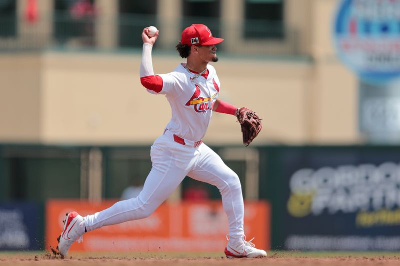 Mar 15, 2025; Jupiter, Florida, USA; St. Louis Cardinals shortstop Masyn Winn (0) throws to first base to retire Toronto Blue Jays left fielder Davis Schneider (not pictured) during the third inning at Roger Dean Chevrolet Stadium. Mandatory Credit: Sam Navarro-Imagn Images