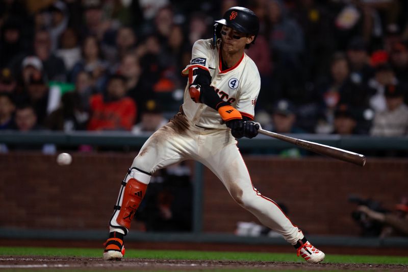 Jun 2, 2025; San Francisco, California, USA; San Francisco Giants center fielder Jung Hoo Lee (51) swings and misses at strike three against the San Diego Padres during the seventh inning at Oracle Park. Mandatory Credit: D. Ross Cameron-Imagn Images