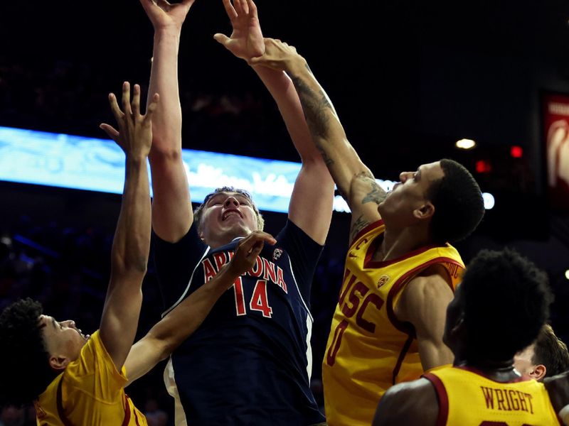 Jan 17, 2024; Tucson, Arizona, USA; Arizona Wildcats center Motiejus Krivas (14) shoots a basket against USC Trojans forward Kijani Wright (33) during the second half at McKale Center. Mandatory Credit: Zachary BonDurant-USA TODAY Sports