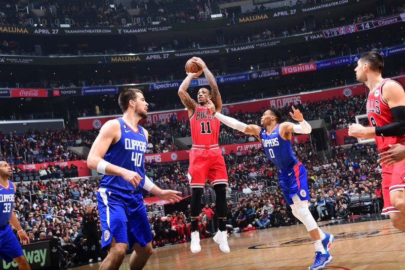 LOS ANGELES, CA - MARCH 27: DeMar DeRozan #11 of the Chicago Bulls shoots the ball during the game against the LA Clippers on March 27, 2023 at Crypto.Com Arena in Los Angeles, California. NOTE TO USER: User expressly acknowledges and agrees that, by downloading and/or using this Photograph, user is consenting to the terms and conditions of the Getty Images License Agreement. Mandatory Copyright Notice: Copyright 2023 NBAE (Photo by Adam Pantozzi/NBAE via Getty Images)
