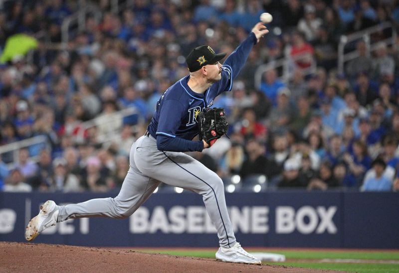 May 17, 2024; Toronto, Ontario, CAN;  Tampa Bay Rays starting pitcher Tyler Alexander (14) delivers a pitch against the Toronto Blue Jays in the first inning at Rogers Centre. Mandatory Credit: Dan Hamilton-USA TODAY Sports