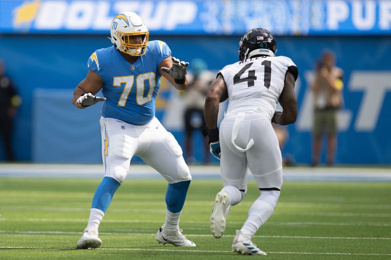 Los Angeles Chargers offensive tackle Rashawn Slater (70) takes his stance during an NFL football game against the Los Angeles Chargers Sunday, Sept. 25, 2022, in Inglewood, Calif. (AP Photo/Kyusung Gong)