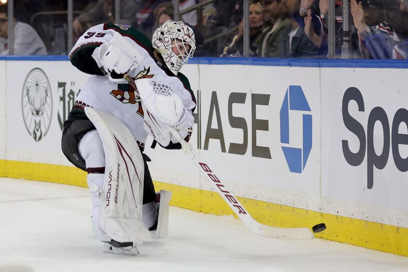 Oct 16, 2023; New York, New York, USA; Arizona Coyotes goaltender Connor Ingram (39) plays the puck behind the net against the New York Rangers during the second period at Madison Square Garden. Mandatory Credit: Brad Penner-USA TODAY Sports