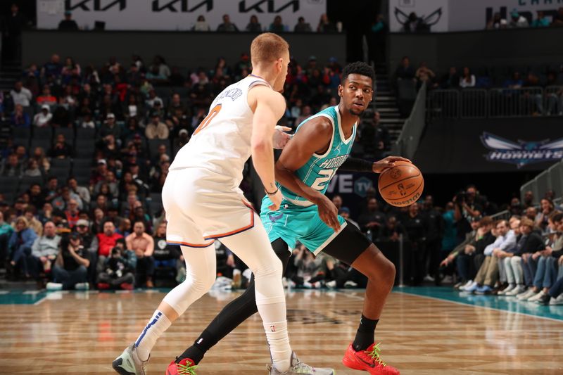 CHARLOTTE, NC - JANUARY 29: Brandon Miller #24 of the Charlotte Hornets handles the ball against Donte Divincenzo #0 of the New York Knicks during the game on January 29, 2024 at Spectrum Center in Charlotte, North Carolina. NOTE TO USER: User expressly acknowledges and agrees that, by downloading and or using this photograph, User is consenting to the terms and conditions of the Getty Images License Agreement. Mandatory Copyright Notice: Copyright 2024 NBAE (Photo by Kent Smith/NBAE via Getty Images)