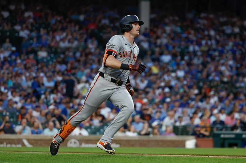 Jun 17, 2024; Chicago, Illinois, USA; San Francisco Giants outfielder Mike Yastrzemski (5) watches his RBI-triple against the Chicago Cubs during the fourth inning at Wrigley Field. Mandatory Credit: Kamil Krzaczynski-USA TODAY Sports