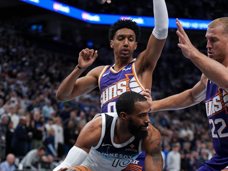 MINNEAPOLIS, MN -  NOVEMBER 17: Mike Conley #10 of the Minnesota Timberwolves handles the ball during the game against the Phoenix Suns on November 17, 2024 at Target Center in Minneapolis, Minnesota. NOTE TO USER: User expressly acknowledges and agrees that, by downloading and or using this Photograph, user is consenting to the terms and conditions of the Getty Images License Agreement. Mandatory Copyright Notice: Copyright 2024 NBAE (Photo by Jordan Johnson/NBAE via Getty Images)