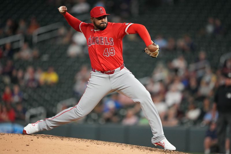 Sep 10, 2024; Minneapolis, Minnesota, USA; Los Angeles Angels relief pitcher Guillermo Zuniga (49) delivers a pitch during the eighth inning against the Minnesota Twins at Target Field. Mandatory Credit: Jordan Johnson-Imagn Images