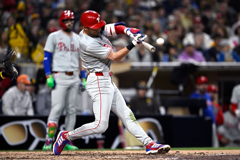 Apr 26, 2024; San Diego, California, USA; Philadelphia Phillies shortstop Trea Turner (7) hits a single against the San Diego Padres during the fourth inning at Petco Park. Mandatory Credit: Orlando Ramirez-USA TODAY Sports