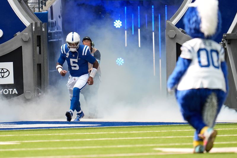 Indianapolis Colts quarterback Anthony Richardson (5) runs to the field before an NFL football game against the Houston Texans, Sunday, Sept. 8, 2024, in Indianapolis. (AP Photo/Michael Conroy)