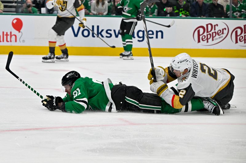 Apr 22, 2024; Dallas, Texas, USA; Dallas Stars center Tyler Seguin (91) is taken down by Vegas Golden Knights defenseman Zach Whitecloud (2) during the second period in game one of the first round of the 2024 Stanley Cup Playoffs at the American Airlines Center. Mandatory Credit: Jerome Miron-USA TODAY Sports