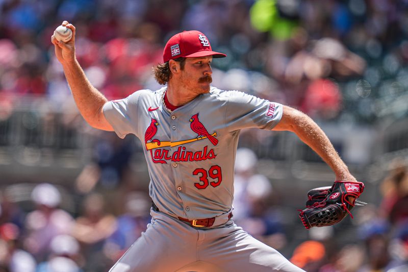 Jul 21, 2024; Cumberland, Georgia, USA; St. Louis Cardinals starting pitcher Miles Mikolas (39) pitches against the Atlanta Braves during the fifth inning at Truist Park. Mandatory Credit: Dale Zanine-USA TODAY Sports