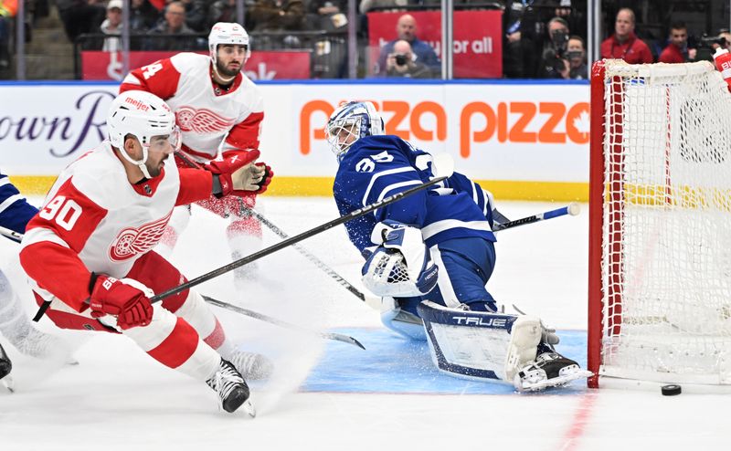 Jan 14, 2024; Toronto, Ontario, CAN;  Toronto Maple Leafs goalie Ilya Samsonov (31) makes a save on a shot from Detroit Red Wings forward Joe Veleno (90) in the second period at Scotiabank Arena. Mandatory Credit: Dan Hamilton-USA TODAY Sports