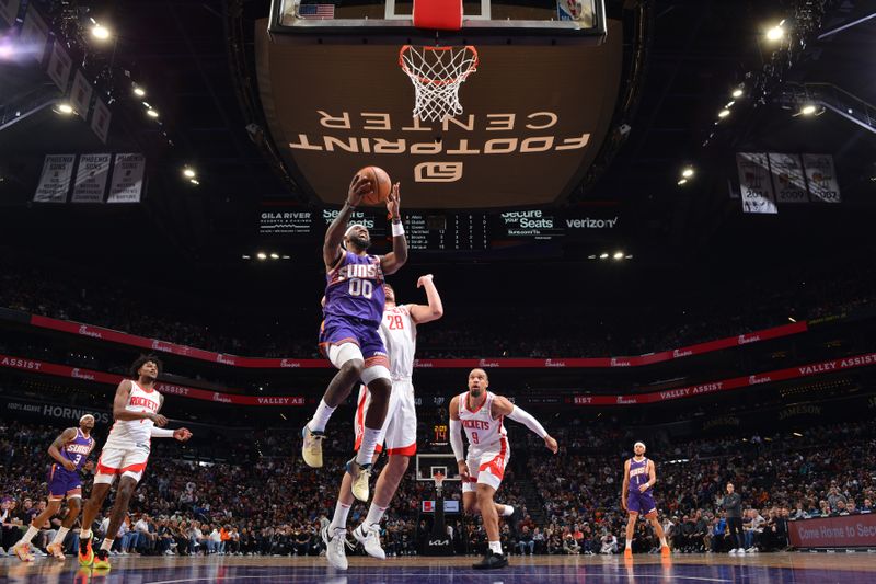 PHOENIX, AZ - MARCH 2: Royce O'Neale #00 of the Phoenix Suns dunks the ball during the game against the Houston Rockets on March 2, 2024 at Footprint Center in Phoenix, Arizona. NOTE TO USER: User expressly acknowledges and agrees that, by downloading and or using this photograph, user is consenting to the terms and conditions of the Getty Images License Agreement. Mandatory Copyright Notice: Copyright 2024 NBAE (Photo by Barry Gossage/NBAE via Getty Images)