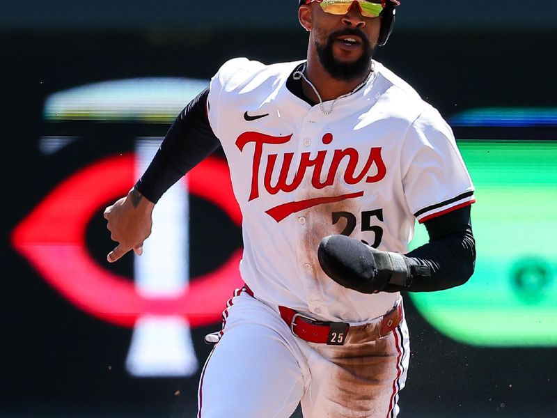 May 8, 2025; Minneapolis, Minnesota, USA; Minnesota Twins center fielder Byron Buxton (25) runs towards third base on a single hit by first baseman Ty France (13) during the first inning against the Baltimore Orioles at Target Field. Mandatory Credit: Matt Krohn-Imagn Images