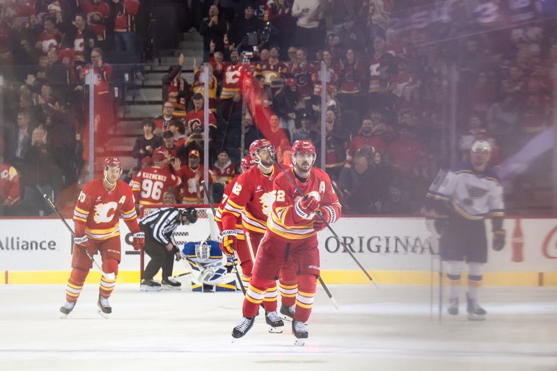 Dec 5, 2024; Calgary, Alberta, CAN; Calgary Flames defenseman MacKenzie Weegar (52) celebrates after scoring a goal against the St. Louis Blues during the third period at Scotiabank Saddledome. Mandatory Credit: Brett Holmes-Imagn Images