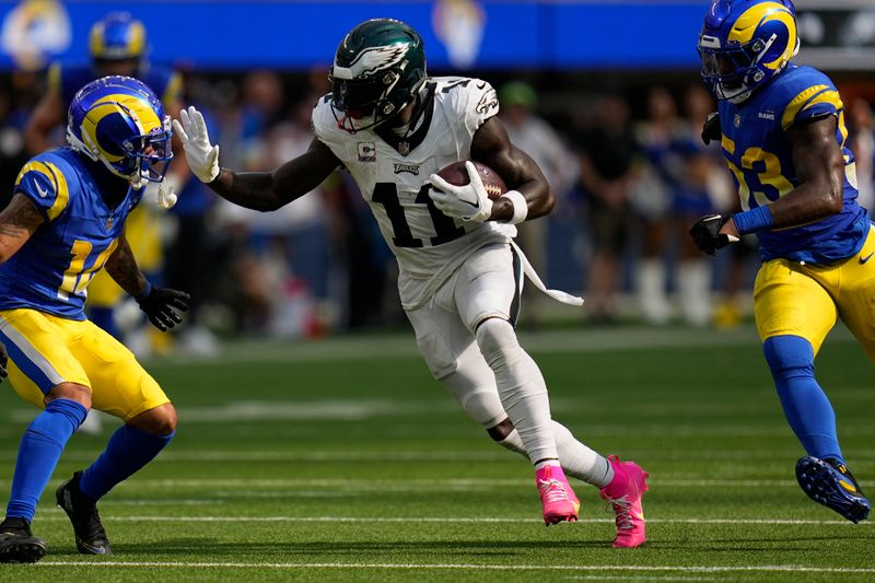 Philadelphia Eagles wide receiver A.J. Brown runs with the ball during the second half of an NFL football game against the Los Angeles Rams, Sunday, Oct. 8, 2023, in Inglewood, Calif. (AP Photo/Gregory Bull)