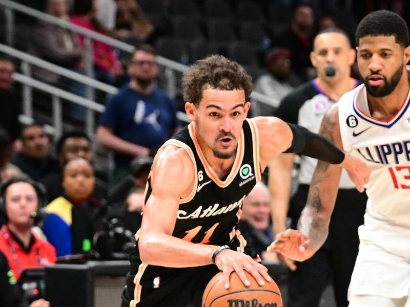 ATLANTA, GA - JANUARY 28: Trae Young #11 of the Atlanta Hawks drives to the basket during the game on January 28, 2023 at State Farm Arena in Atlanta, Georgia.  NOTE TO USER: User expressly acknowledges and agrees that, by downloading and/or using this Photograph, user is consenting to the terms and conditions of the Getty Images License Agreement. Mandatory Copyright Notice: Copyright 2023 NBAE (Photo by Adam Hagy/NBAE via Getty Images)