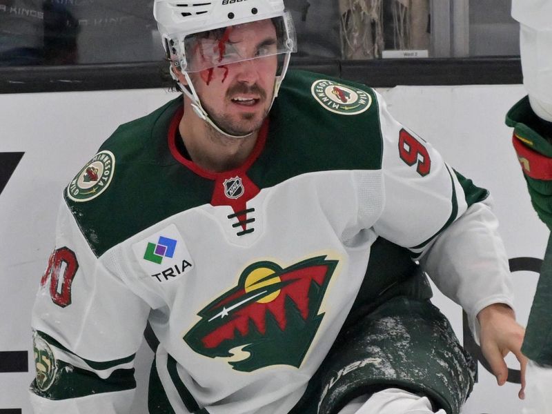 Jan 5, 2026; Los Angeles, California, USA; Minnesota Wild left wing Marcus Johansson (90) left the game with an injury after he was checked into the boards in the third period against the Los Angeles Kings at Crypto.com Arena. Mandatory Credit: Jayne Kamin-Oncea-Imagn Images