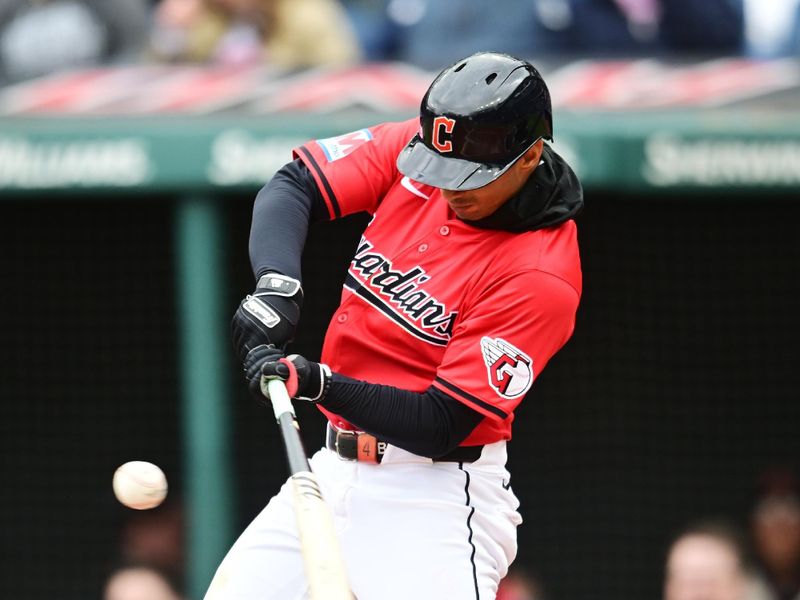 Apr 21, 2024; Cleveland, Ohio, USA; Cleveland Guardians shortstop Brayan Rocchio (4) hits a double during the third inning against the Oakland Athletics at Progressive Field. Mandatory Credit: Ken Blaze-USA TODAY Sports