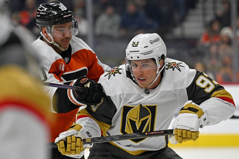 Dec 11, 2025; Philadelphia, Pennsylvania, USA; Vegas Golden Knights right wing Mitch Marner (93) is checked by Philadelphia Flyers right wing Bobby Brink (10) during the first period at Xfinity Mobile Arena. Mandatory Credit: Eric Hartline-Imagn Images