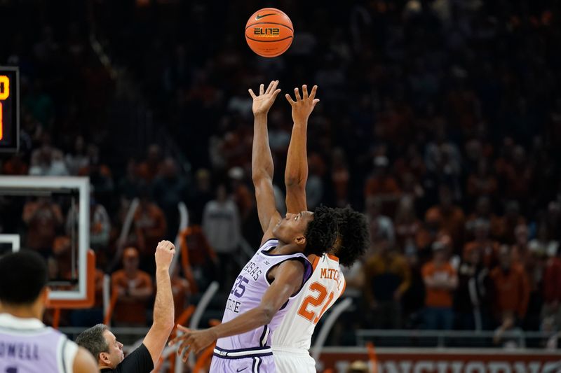 Jan 3, 2023; Austin, Texas, USA; Kansas State Wildcats forward Nae'Qwan Tomlin (35) and Texas Longhorns forward Dillon Mitchell (23) in a jump ball to start the game at Moody Center. Mandatory Credit: Scott Wachter-USA TODAY Sports