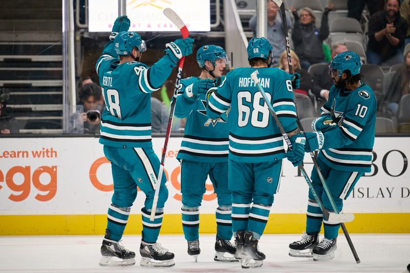 Nov 7, 2023; San Jose, California, USA; San Jose Sharks center William Eklund (72) celebrates with center Tomas Hertl (48) and left wing Mike Hoffman (68) and left wing Anthony Duclair (10) after scoring a goal against the Philadelphia Flyers during the second period at SAP Center at San Jose. Mandatory Credit: Robert Edwards-USA TODAY Sports