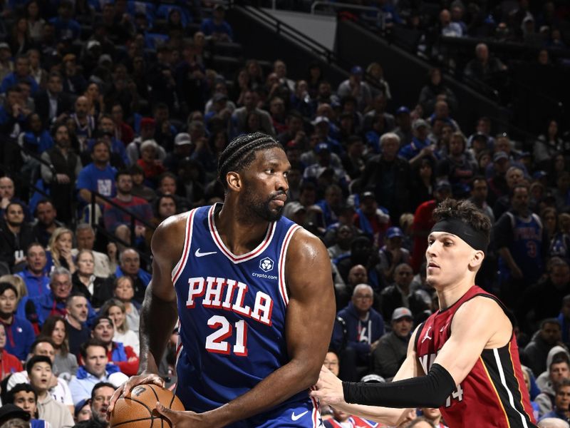 PHILADELPHIA, PA - APRIL 17:  Joel Embiid #21 of the Philadelphia 76ers handles the ball during the game against the Miami Heat during the 2024 NBA Play-In Tournament on April 17, 2024 at the Wells Fargo Center in Philadelphia, Pennsylvania NOTE TO USER: User expressly acknowledges and agrees that, by downloading and/or using this Photograph, user is consenting to the terms and conditions of the Getty Images License Agreement. Mandatory Copyright Notice: Copyright 2024 NBAE (Photo by David Dow/NBAE via Getty Images)