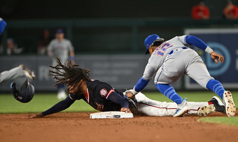 Jul 2, 2024; Washington, District of Columbia, USA; Washington Nationals center fielder James Wood (50) is tagged out at second base by New York Mets shortstop Francisco Lindor (12) during the ninth inning at Nationals Park. Mandatory Credit: Rafael Suanes-USA TODAY Sports