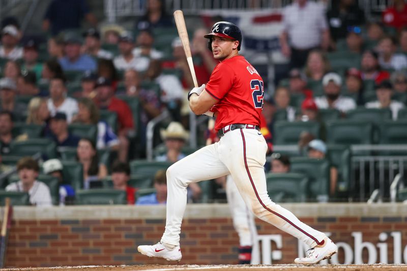 Jun 14, 2024; Atlanta, Georgia, USA; Atlanta Braves first baseman Matt Olson (28) hits a double against the Tampa Bay Rays in the sixth inning at Truist Park. Mandatory Credit: Brett Davis-USA TODAY Sports
