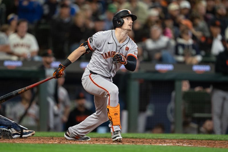 Aug 23, 2024; Seattle, Washington, USA; San Francisco Giants right fielder Mike Yastrzemski (5) hits a solo home run during the seventh inning against the Seattle Mariners at T-Mobile Park. Mandatory Credit: Stephen Brashear-USA TODAY Sports